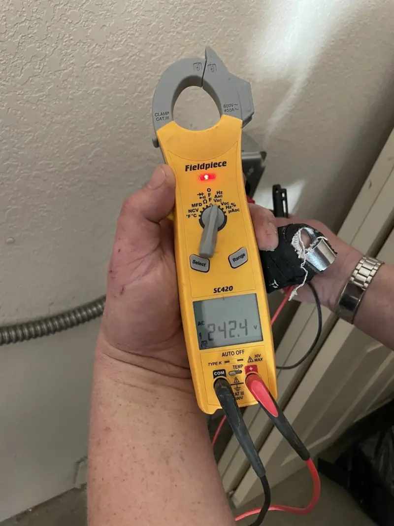 Voltage testing with clamp meter during Generator Installation in Mount Angel